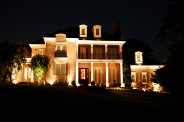 large estate at night with dramatic lighting